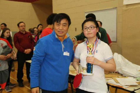 Dr. Steven Qian with Amy Hong at a local student ping-pong tournament