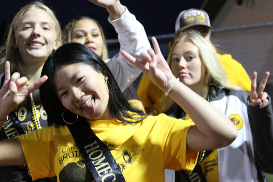 Laura Phan (front), Brynn Nelson, Keyona Robinson, and Laura Green (back, left to right), celebrate homecoming.